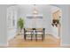 Inviting dining room with decorative chandelier and light-filled windows offers a warm and welcoming space at 3334 W 37Th Ave, Denver, CO 80211