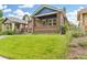 Charming brick home featuring a well-maintained lawn and inviting front porch at 3334 W 37Th Ave, Denver, CO 80211