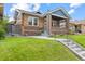 Charming brick home featuring a well-maintained lawn and inviting front porch at 3334 W 37Th Ave, Denver, CO 80211