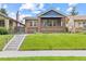 Charming brick home featuring a well-maintained lawn and inviting front porch at 3334 W 37Th Ave, Denver, CO 80211