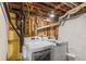 Unfinished basement laundry room with washer and dryer at 3334 W 37Th Ave, Denver, CO 80211