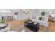 Bright open-concept living and dining rooms with hardwood floors and neutral decor at 3334 W 37Th Ave, Denver, CO 80211