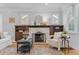Living room featuring a fireplace with detailed mantel and shelving at 3334 W 37Th Ave, Denver, CO 80211