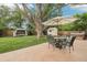 Inviting backyard featuring a patio set, gazebo, well-kept lawn, mature trees and perimeter fencing at 7075 Welch Ct, Arvada, CO 80004
