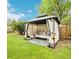 Inviting backyard space featuring a gazebo with seating, string lights, and lush green lawn for outdoor relaxation at 7075 Welch Ct, Arvada, CO 80004