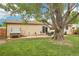 Backyard with a patio area featuring a hot tub and mature landscaping at 7075 Welch Ct, Arvada, CO 80004