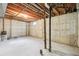 Spacious unfinished basement with concrete floor and exposed pipes, providing a blank canvas for customization and storage at 7075 Welch Ct, Arvada, CO 80004