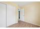 Bright bedroom features laminate flooring, a large closet and an ensuite bathroom for added convenience at 7075 Welch Ct, Arvada, CO 80004