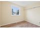 Unfurnished room with wood floors and a sunny window; has room for a bed and furnishings at 7075 Welch Ct, Arvada, CO 80004
