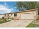 Charming home featuring a two-car garage, well-maintained lawn, and beautiful curb appeal with a classic design at 7075 Welch Ct, Arvada, CO 80004