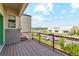 Balcony view with brown wood and metal railing at 5682 N Galena St, Denver, CO 80238