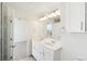 Bathroom with a double sink vanity and stylish lighting at 5682 N Galena St, Denver, CO 80238