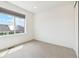 Spare bedroom with neutral carpet and large window at 5682 N Galena St, Denver, CO 80238