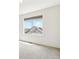 Bright bedroom featuring carpeted floors and a large window with neighborhood views at 5682 N Galena St, Denver, CO 80238