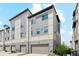 Townhome featuring multiple stories, garage parking, and light-colored siding at 5682 N Galena St, Denver, CO 80238