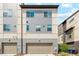 Townhome featuring multiple stories, garage parking, and light-colored siding at 5682 N Galena St, Denver, CO 80238