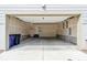 Attached garage with concrete floors and a door leading to the house at 5682 N Galena St, Denver, CO 80238
