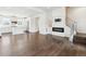 Open living space featuring a fireplace, hardwood floors, and modern staircase at 5682 N Galena St, Denver, CO 80238