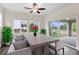 Bright dining room features modern chairs and table near sliding glass doors to the backyard at 17258 E 109Th Ave, Commerce City, CO 80022