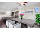 The dining area features a modern table, seating, and an open floor plan with a partial view of the kitchen at 17258 E 109Th Ave, Commerce City, CO 80022