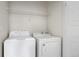 Laundry room featuring a washer, dryer, and wire shelving for storage at 17258 E 109Th Ave, Commerce City, CO 80022