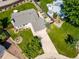 Aerial view of the house featuring a spacious backyard with mature trees and landscaping at 18159 E Crestline Cir, Centennial, CO 80015