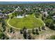 An aerial view of a large park with walking paths, tennis and basketball courts at 18159 E Crestline Cir, Centennial, CO 80015
