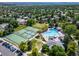 Aerial view of neighborhood amenities showcasing the community pool, tennis courts, and surrounding homes at 18159 E Crestline Cir, Centennial, CO 80015