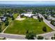 Aerial view of the school with a large green field for recreation at 18159 E Crestline Cir, Centennial, CO 80015