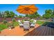Backyard featuring a deck with an umbrella and outdoor seating at 18159 E Crestline Cir, Centennial, CO 80015