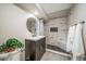 Bathroom featuring a tiled walk-in shower and updated vanity at 18159 E Crestline Cir, Centennial, CO 80015