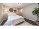 A well lit main bedroom with modern decor and hardwood floors at 18159 E Crestline Cir, Centennial, CO 80015