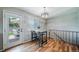 Cozy dining area featuring hardwood floors and a view of the outdoor patio at 18159 E Crestline Cir, Centennial, CO 80015