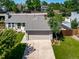 A charming single-Gathering home features a well-manicured lawn and attached two-car garage at 18159 E Crestline Cir, Centennial, CO 80015
