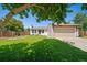 Charming single-story home features a well-manicured lawn and attached two car garage at 18159 E Crestline Cir, Centennial, CO 80015