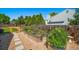 Backyard garden area with gravel ground cover, stone paver walkway, and raised planters at 18159 E Crestline Cir, Centennial, CO 80015