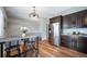 Kitchen with granite countertops, stainless steel appliances, and an adjacent dining area at 18159 E Crestline Cir, Centennial, CO 80015