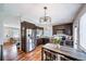 Open concept kitchen with a dining area, stainless steel appliances, and granite countertops at 18159 E Crestline Cir, Centennial, CO 80015