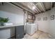 A utility room featuring a washer and dryer at 18159 E Crestline Cir, Centennial, CO 80015