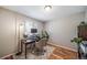 Home office space with desk, lamp, and a chair on hardwood floors at 18159 E Crestline Cir, Centennial, CO 80015
