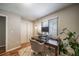 Home office space with desk, lamp, and a chair on hardwood floors at 18159 E Crestline Cir, Centennial, CO 80015