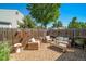 Outdoor patio seating area with comfortable wicker furniture set on gravel ground cover at 18159 E Crestline Cir, Centennial, CO 80015