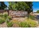 A Covenant Community sign is surrounded by a rock base and a flower garden at 18159 E Crestline Cir, Centennial, CO 80015