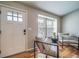 Cozy sitting room with hardwood floors, natural light, and comfortable seating at 18159 E Crestline Cir, Centennial, CO 80015