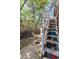 Backyard with access stairs to a second-floor deck and privacy fence at 2410 W 36Th Ave, Denver, CO 80211