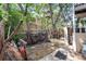 Untidy backyard with partial stone patio and a privacy fence at 2410 W 36Th Ave, Denver, CO 80211
