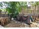Untidy backyard with partial stone patio and a privacy fence at 2410 W 36Th Ave, Denver, CO 80211