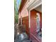 Red brick exterior detail showcasing the side entrance, offering a glimpse into the home's classic architecture at 2410 W 36Th Ave, Denver, CO 80211