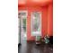 Quaint interior view showcasing a sunlit window with an open door, highlighting the home's potential at 2410 W 36Th Ave, Denver, CO 80211