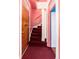 Charming interior entryway with a wooden door and a staircase leading to the upper level of the home at 2410 W 36Th Ave, Denver, CO 80211